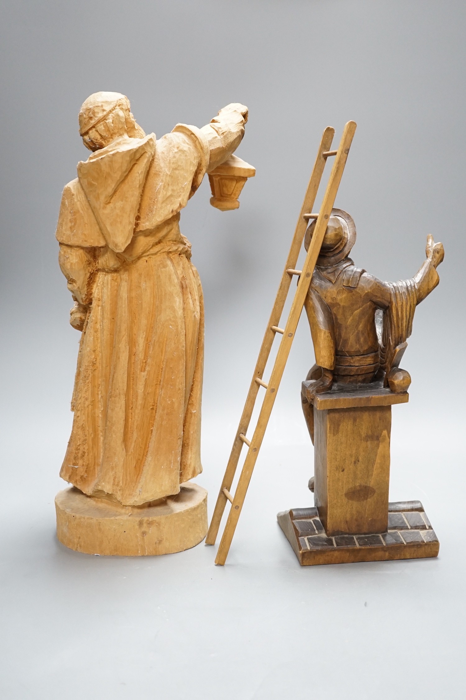 Two Black Forest carvings of a friar and a steeplejack, tallest 40cm